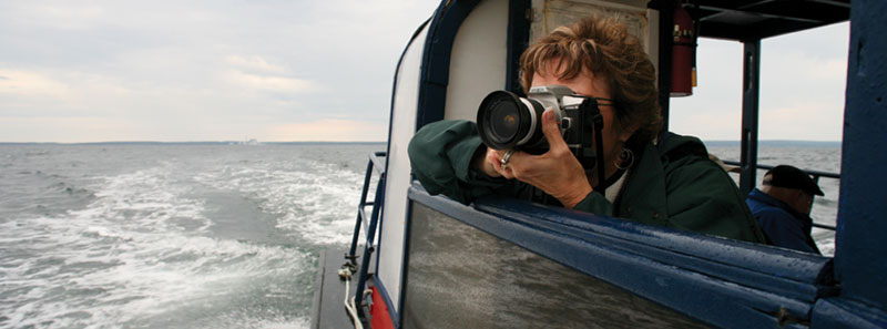 Lady with camera on Boat tour